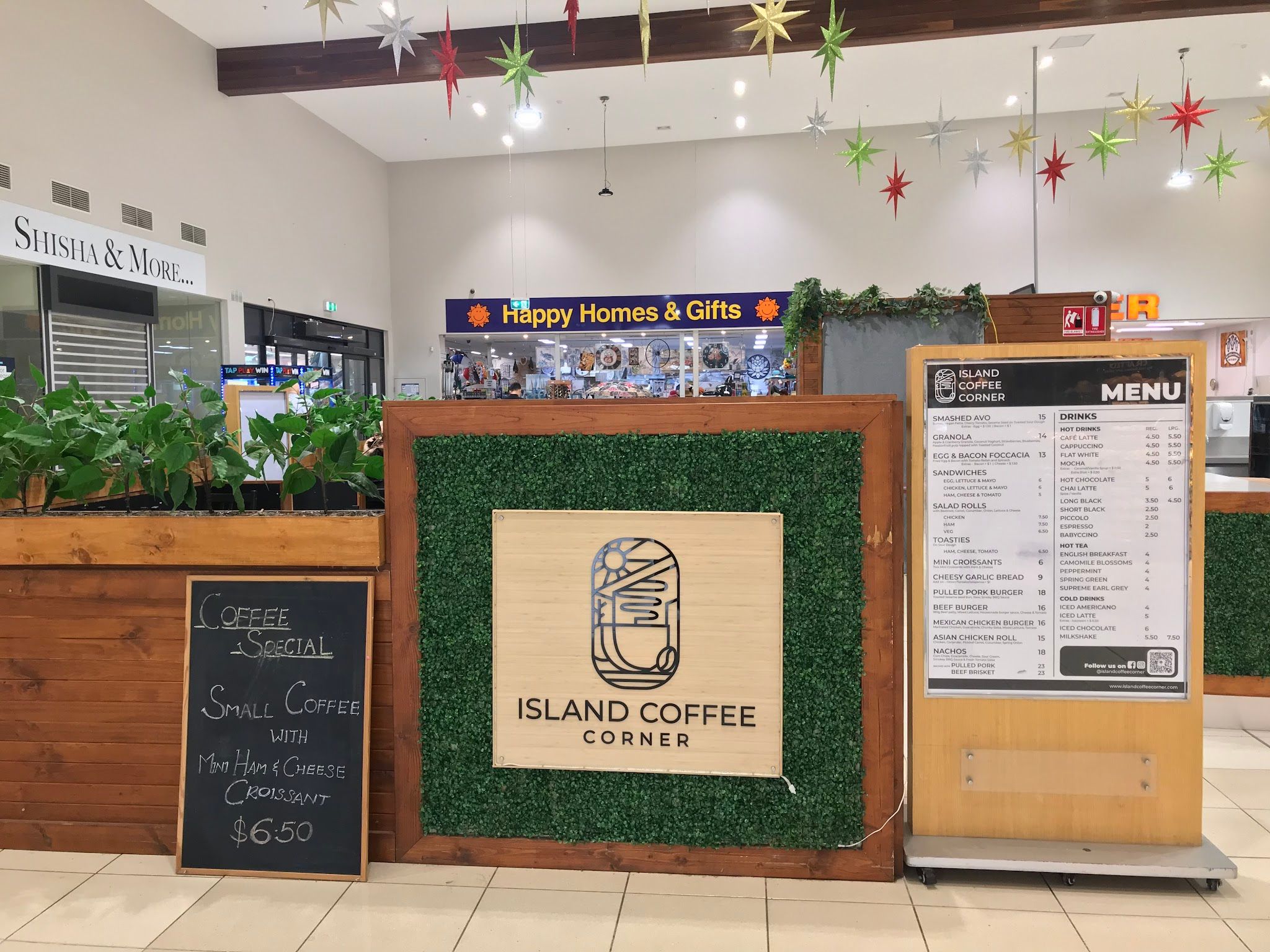 Island Coffee Corner kiosk with logo signage, menu board stand and coffee special chalkboard